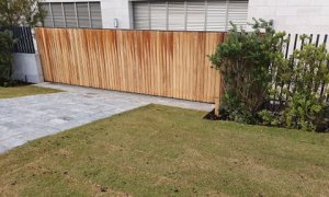 large timber automated sliding security gate